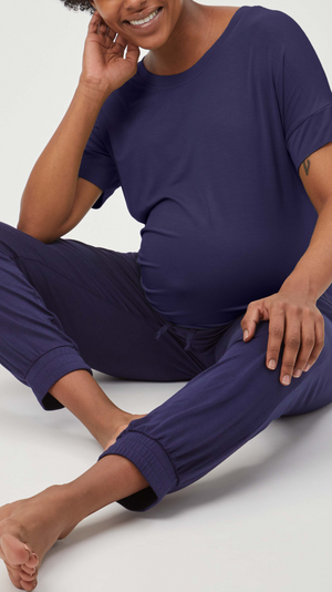 Stowaway Collection Maternity Loungewear Jogger in Navy - Front View, model seated